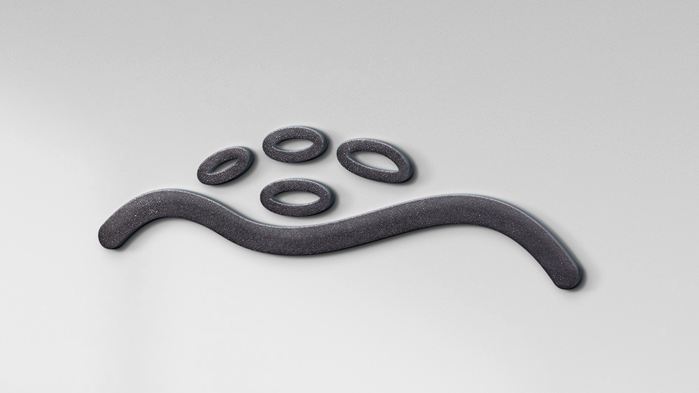 ZkT branding applied to granite wall surface